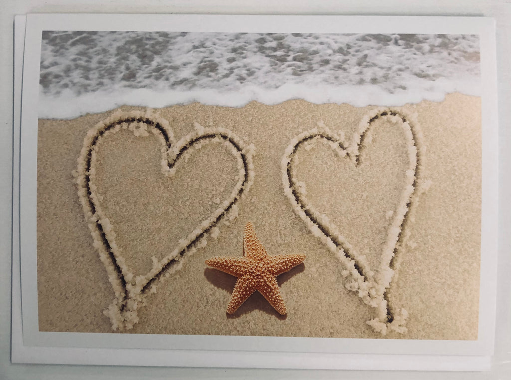 Two hearts in sand